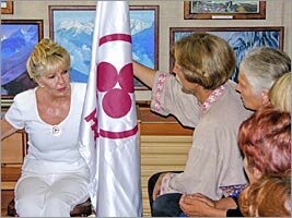 Alicia Rodriges tells about value of the Banner of Peace to visitors of the Roerich's museum of Uimon valley